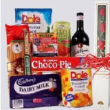 Basket of celebration with a box of three red roses