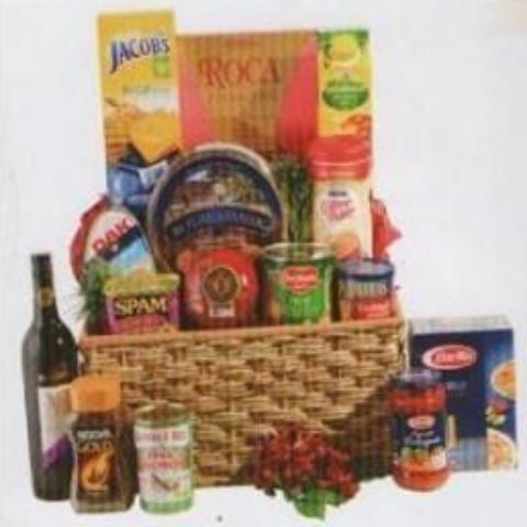 Basket of holiday with a box of three red roses