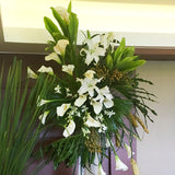 Calla lilies, casa blanca lilies, gold or green berries and orchids, with rattle snakes